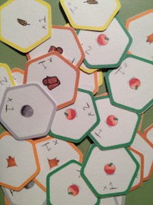 Hex punched, corners rounded, glued back to back. There's got to be a better way!