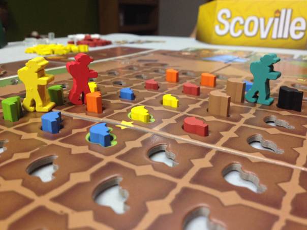 The Yellow and Red player are mired in battle for the peppers in that part of the board.