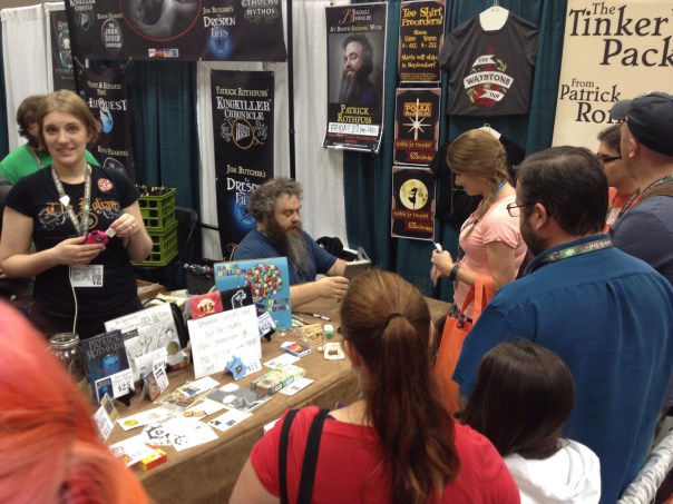 Patrick Rothfuss signing stuff.